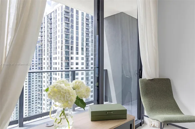 a swimming pool with outdoor seating and yard