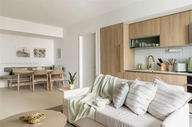 a kitchen with stainless steel appliances granite countertop a stove and a microwave