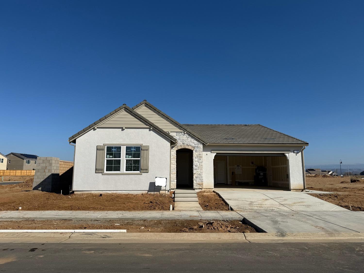 a view of a house with a yard and plants