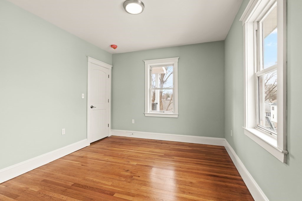 564 Lagrange Street, Unit 2 Boston, MA 02132 - Photo 20 of 27 a view of empty room with wooden floor and fan