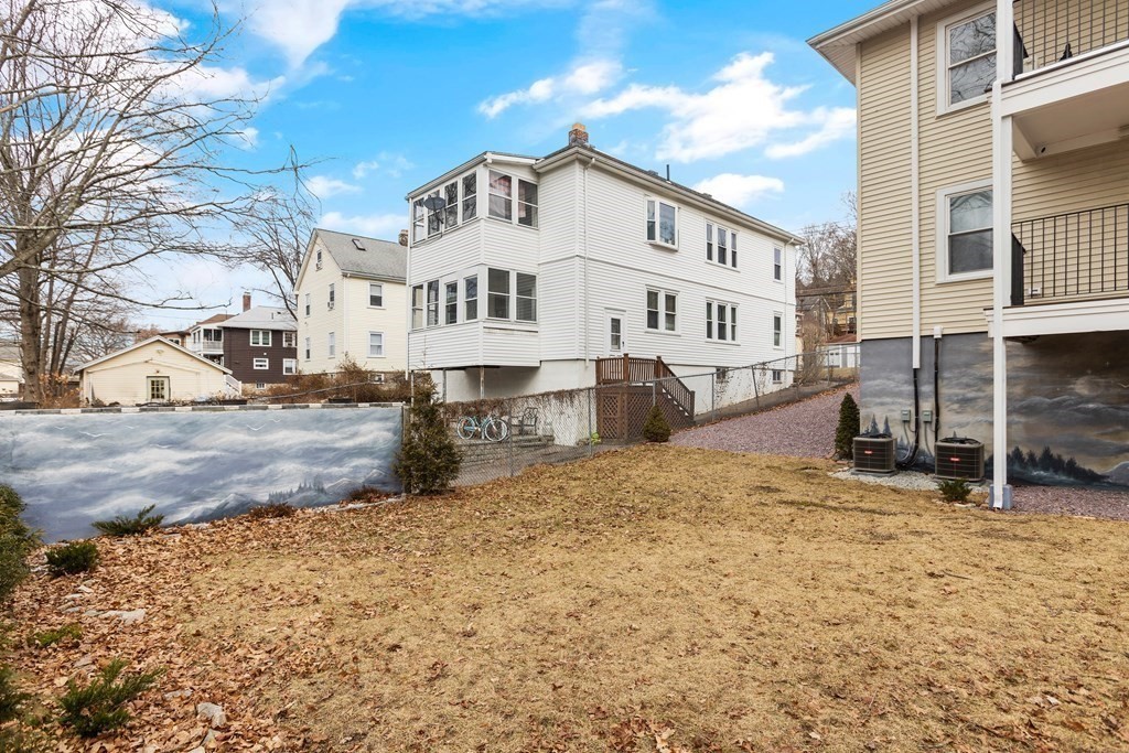 564 Lagrange Street, Unit 2 Boston, MA 02132 - Photo 24 of 27 a view of a white house with a snow on the road