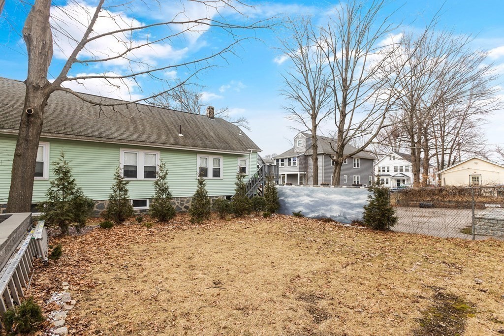 564 Lagrange Street, Unit 2 Boston, MA 02132 - Photo 25 of 27 a front view of a house with a yard