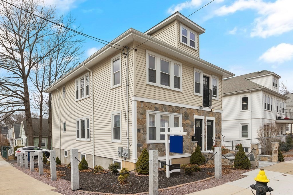 564 Lagrange Street, Unit 2 Boston, MA 02132 - Photo 26 of 27 a front view of a residential houses with yard