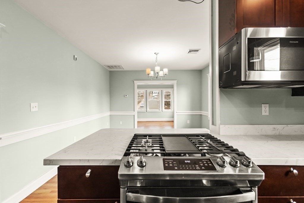 564 Lagrange Street, Unit 2 Boston, MA 02132 - Photo 4 of 27 a stove top oven sitting inside of a kitchen