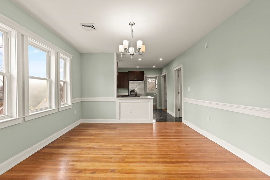 564 Lagrange Street, Unit 2 Boston, MA 02132 - Photo 7 of 27 a view of a kitchen with wooden floor and a kitchen