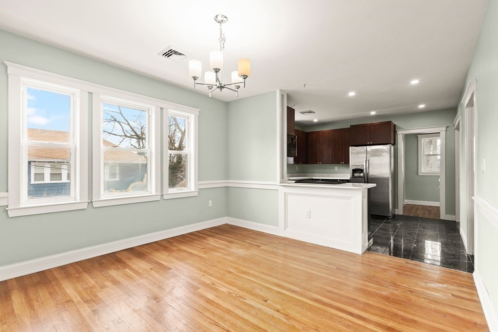564 Lagrange Street, Unit 2 Boston, MA 02132 - Photo 8 of 27 a view of kitchen with granite countertop cabinets and refrigerator