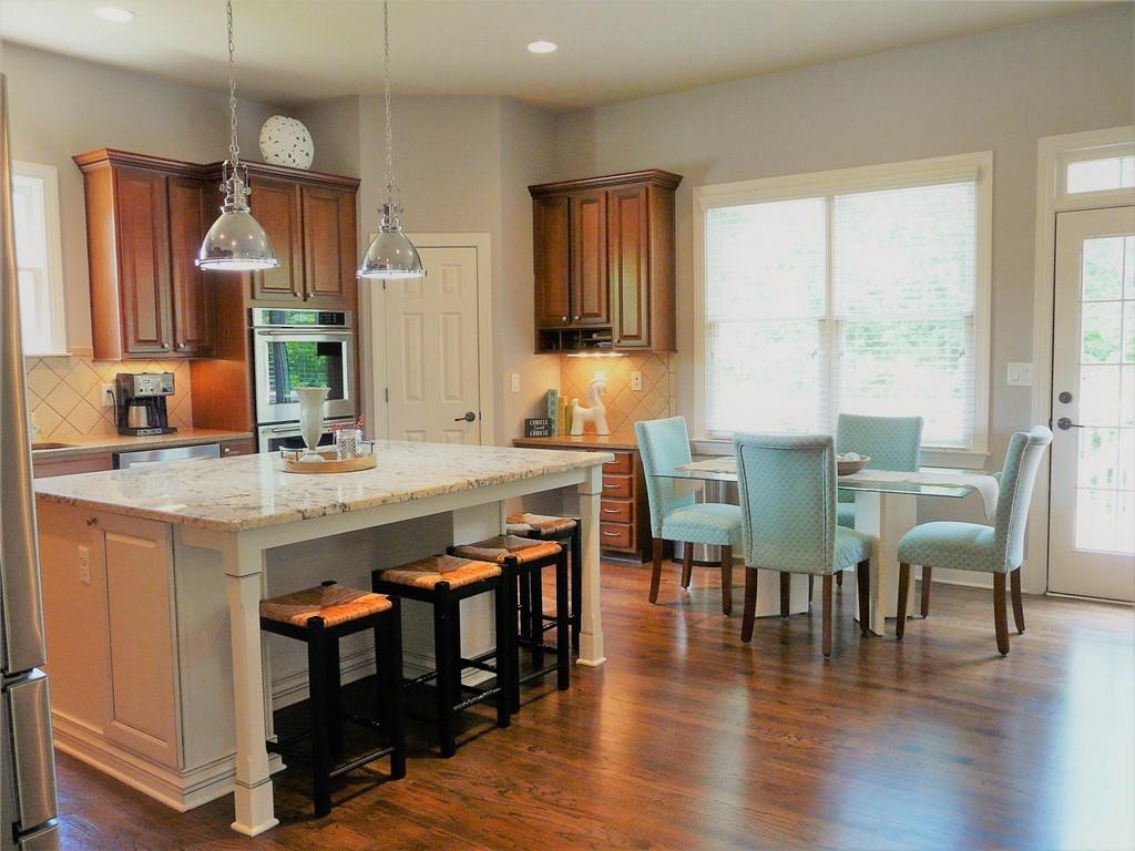 3970 Sweeting Street Cumming, GA 30041 - Photo 10 of 17 a view of dining table and chairs in a room