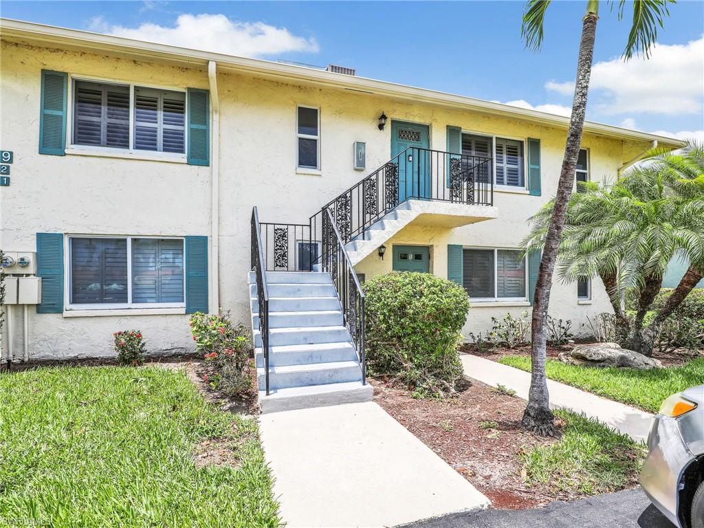 119 Harrison Road, Unit 16 Naples, FL 34112 - Photo 1 of 26 View of property with stairway