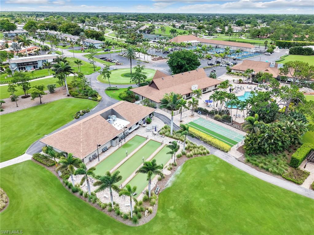 119 Harrison Road, Unit 16 Naples, FL 34112 - Photo 22 of 26 Aerial view of a pool