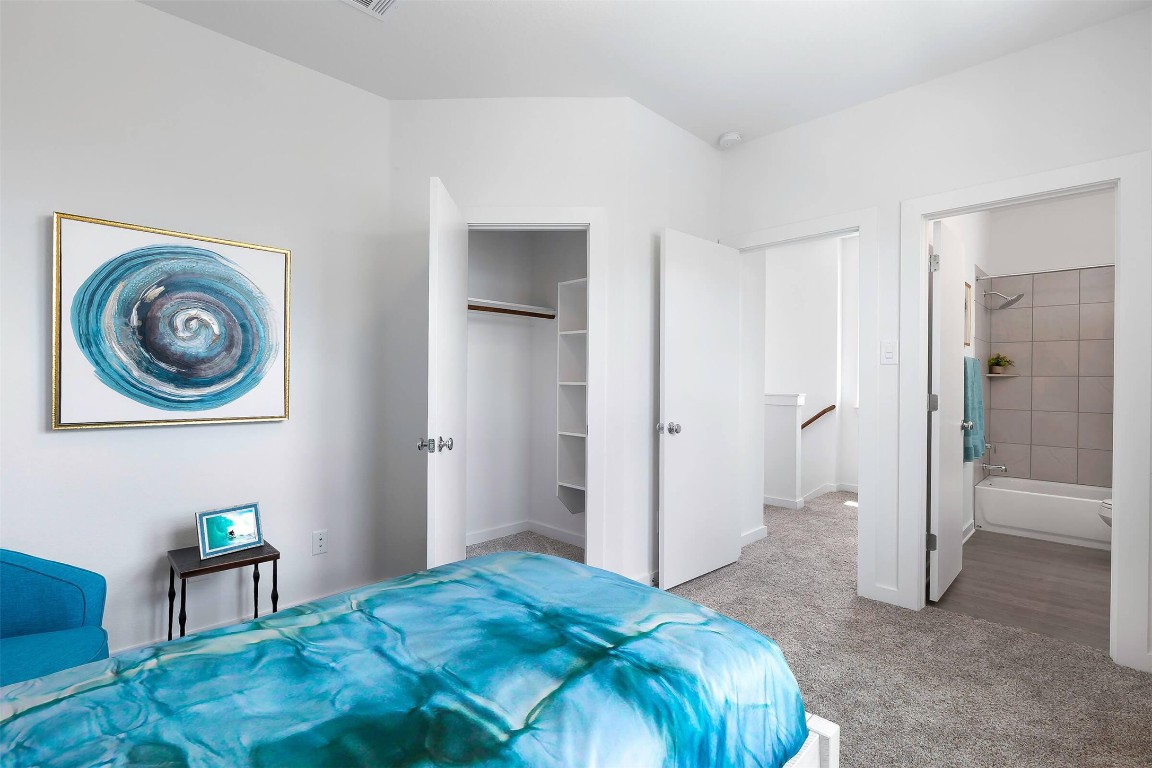 428 Leo Lane Leander, TX 78641 - Photo 14 of 21 a bedroom with a bed and a bookshelf