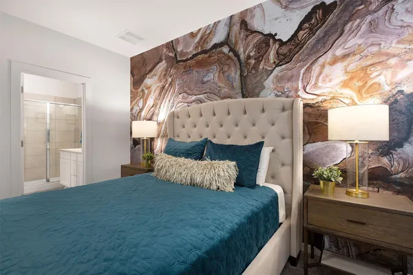 a bedroom with a bed and window