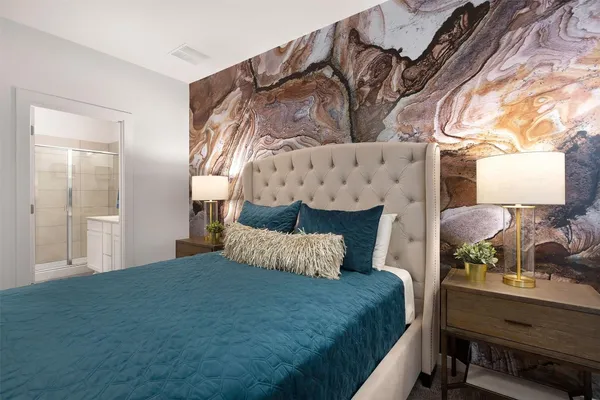 a bedroom with a bed and window