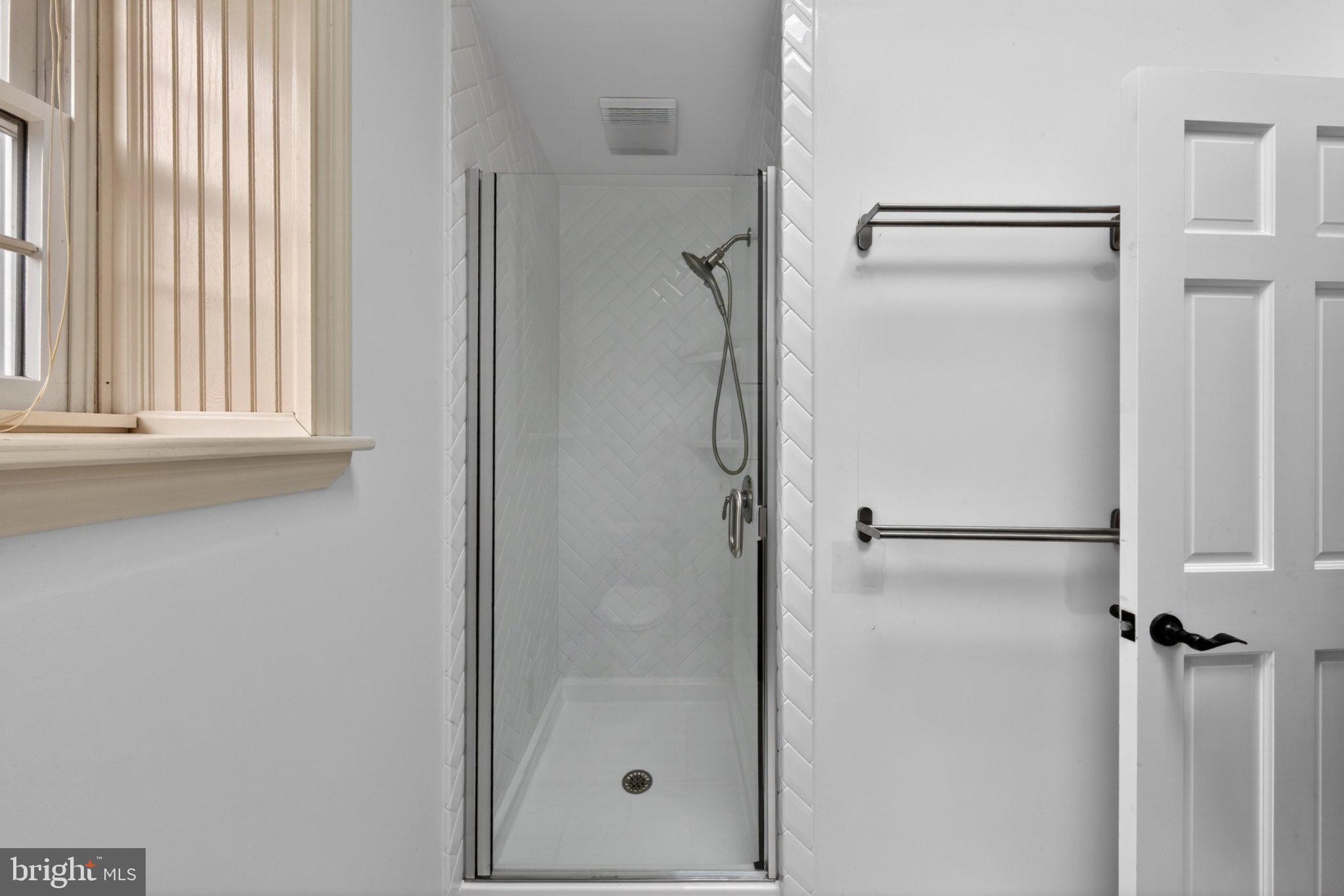 1020 Jeffrey Road Wilmington, DE 19810 - Photo 58 of 108 Sleek modern shower in bright space.