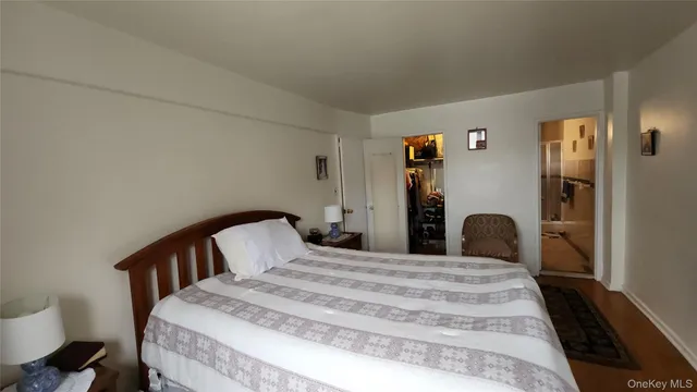 a bedroom with a bed and a table in it