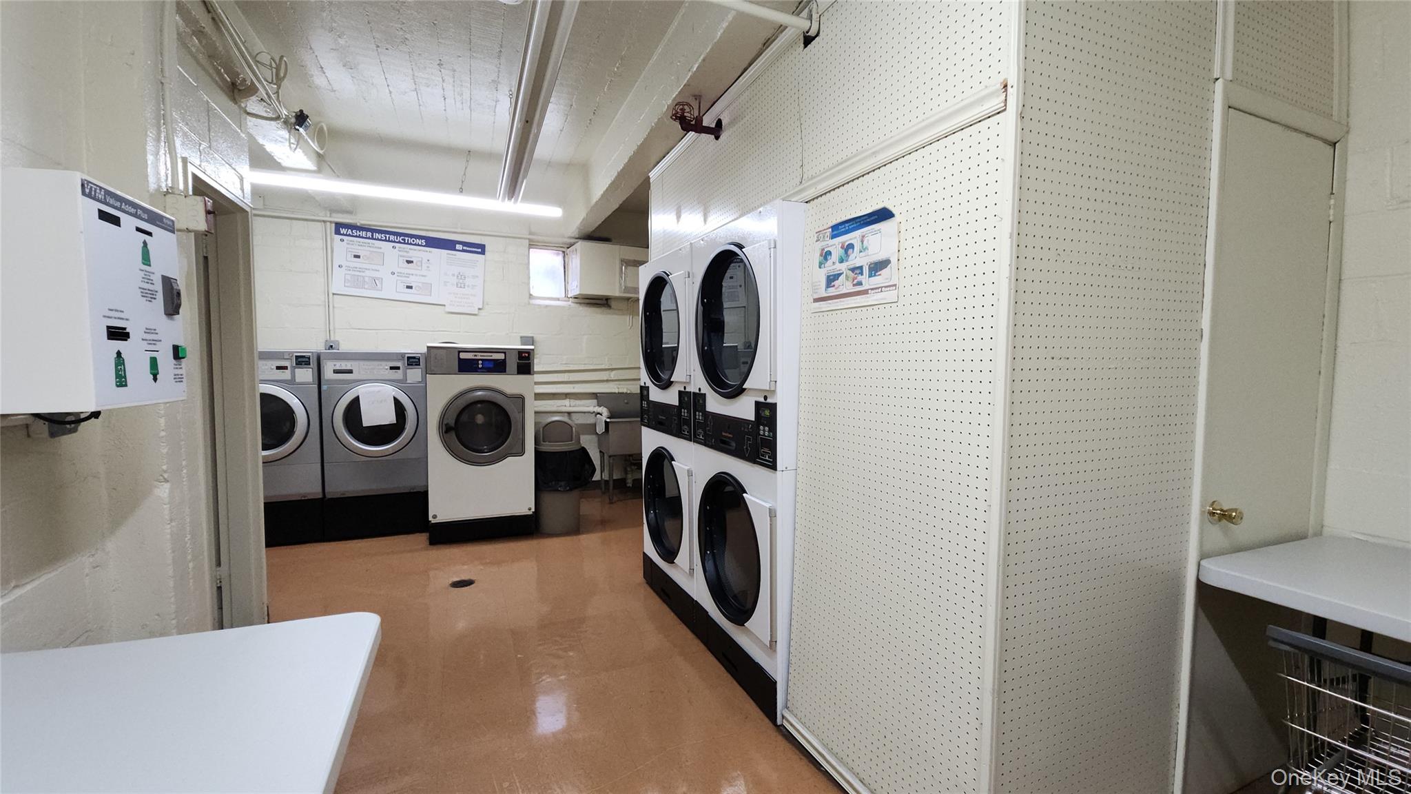 99-10 60th Avenue, Unit 3H Queens, NY 11368 - Photo 22 of 25 a utility room with dryer and washer