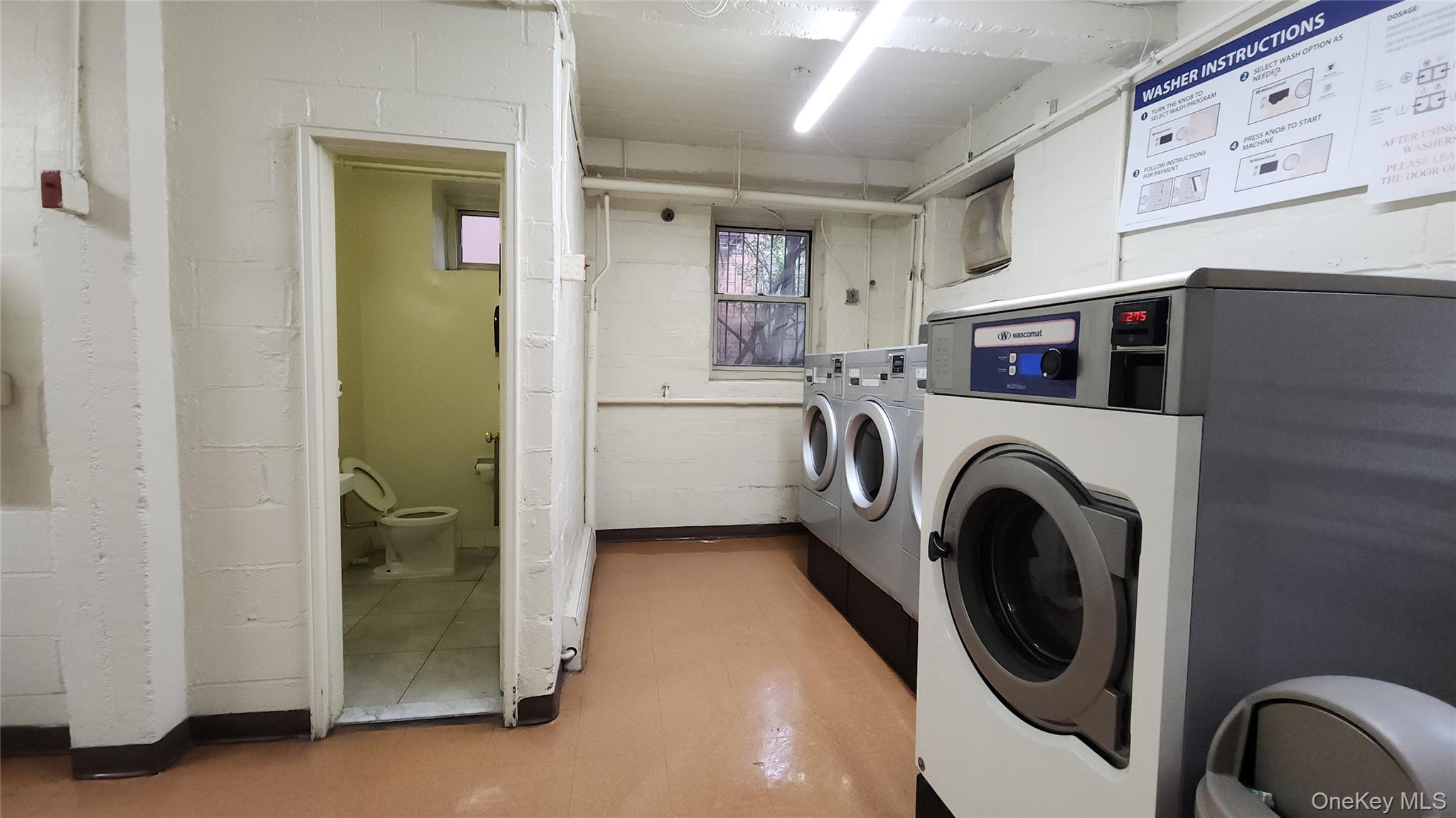 99-10 60th Avenue, Unit 3H Queens, NY 11368 - Photo 23 of 25 a utility room with dryer and washer