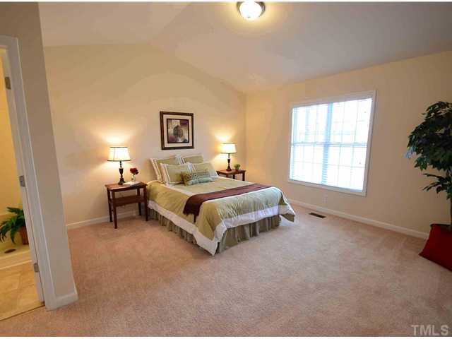 5660 Zacks Mill Road Angier, NC 27501 - Photo 3 of 24 Wow, the master bedroom suite is huge with new paint, new carpet, new lighting, new 2 inch blinds and comes with a luxurious and large master spa bathroom.
