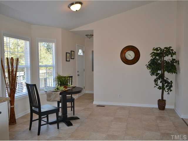 5660 Zacks Mill Road Angier, NC 27501 - Photo 8 of 24 The dining room is so spacious with bonus bay window, new flooring, new paint, new lighting, new 2 inch blinds.