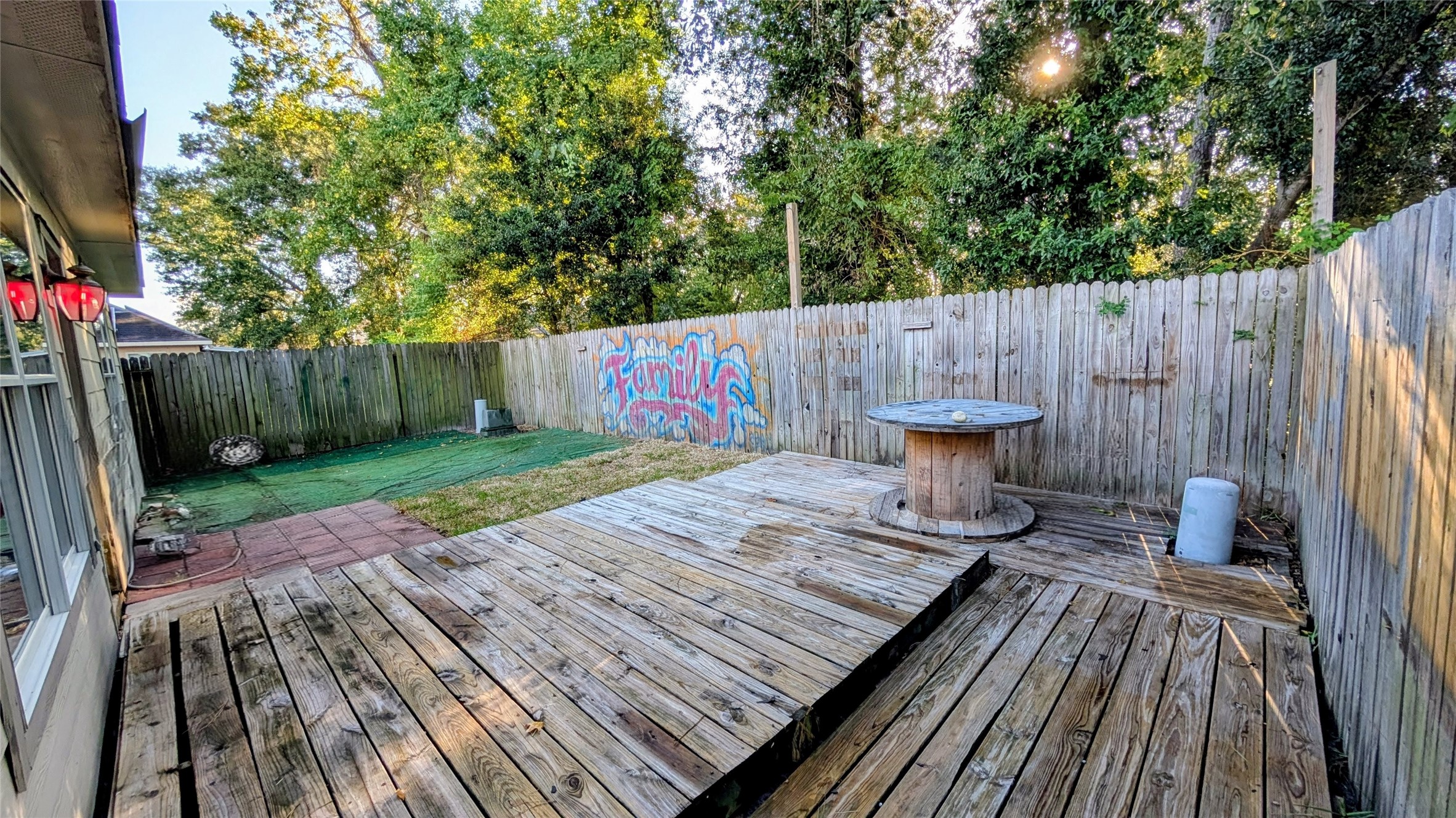 1918 Adobe Stone Drive Humble, TX 77396 - Photo 15 of 16 a view of deck with wooden floor and outdoor seating
