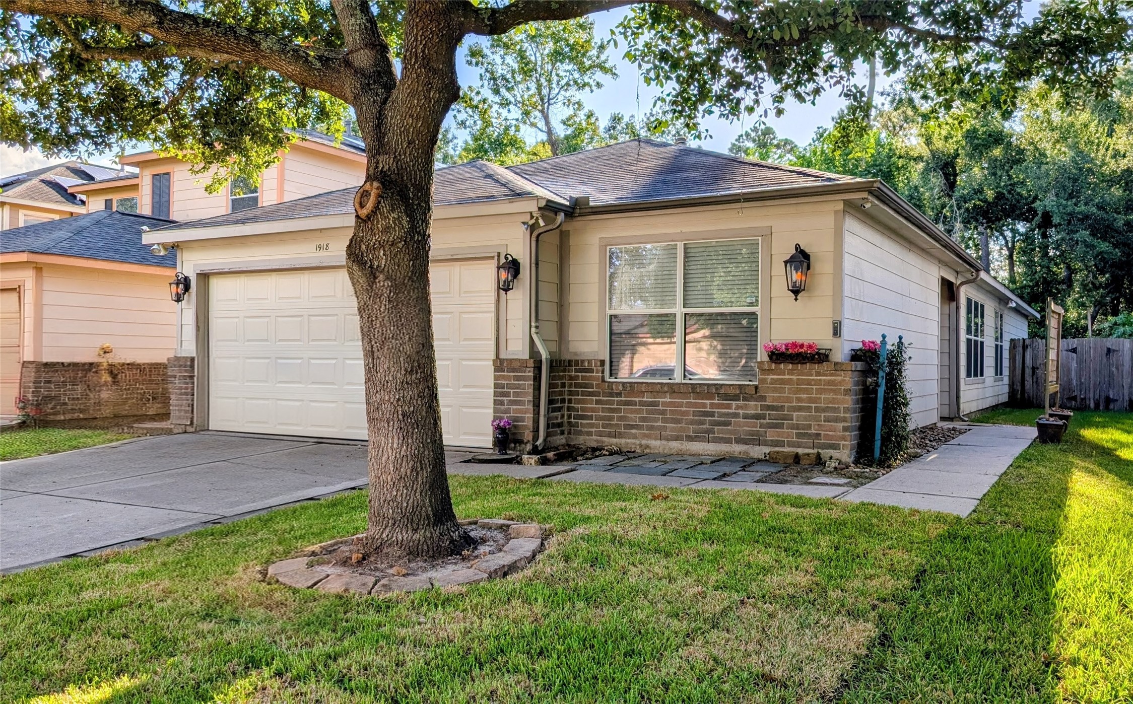 1918 Adobe Stone Drive Humble, TX 77396 - Photo 3 of 16 a front view of a house with a yard