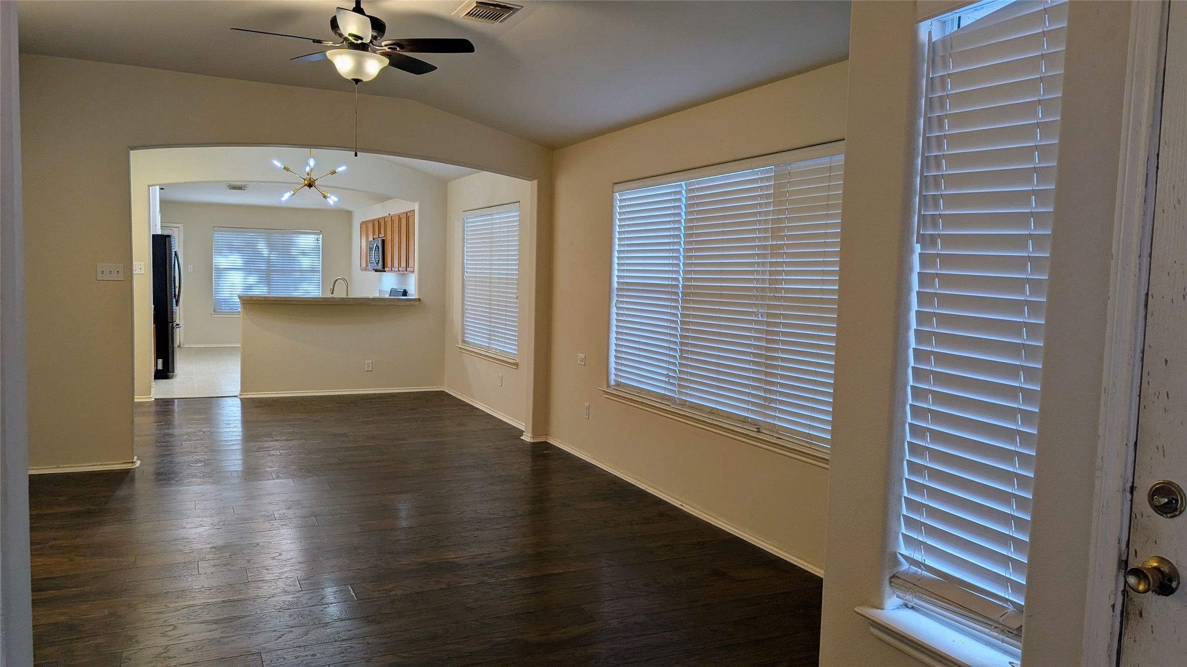 1918 Adobe Stone Drive Humble, TX 77396 - Photo 5 of 16 wooden floor in an empty room with a window