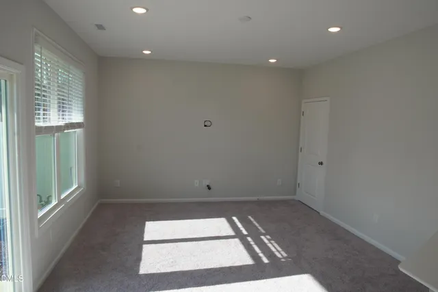 a view of a balcony with wooden floor