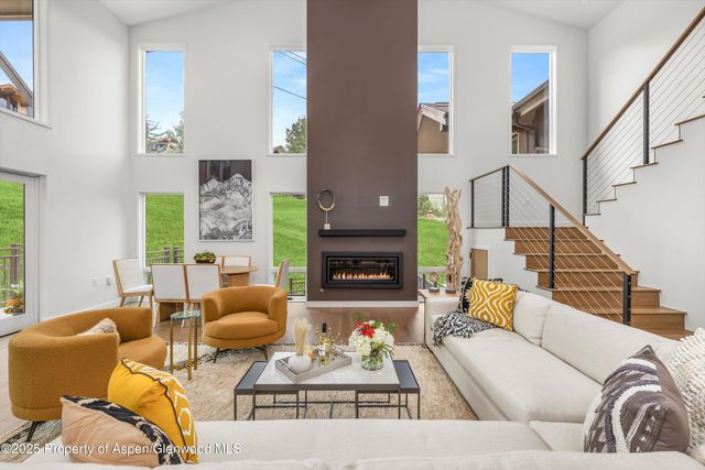 a living room with furniture fireplace and a fireplace