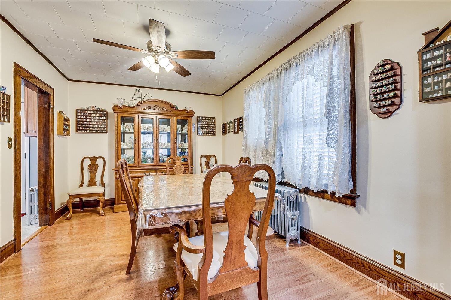 7 Clum Avenue Fords, NJ 08863 - Photo 12 of 43 a dining room with furniture a chandelier and wooden floor