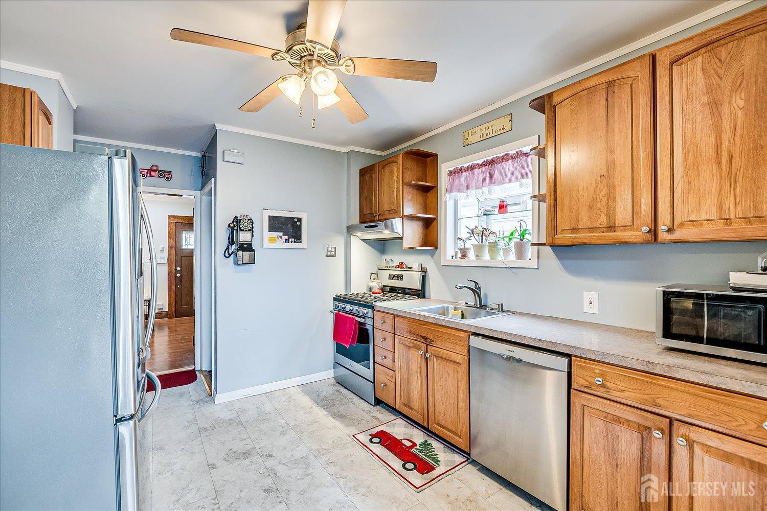 7 Clum Avenue Fords, NJ 08863 - Photo 16 of 43 a kitchen with stainless steel appliances granite countertop a refrigerator and a sink