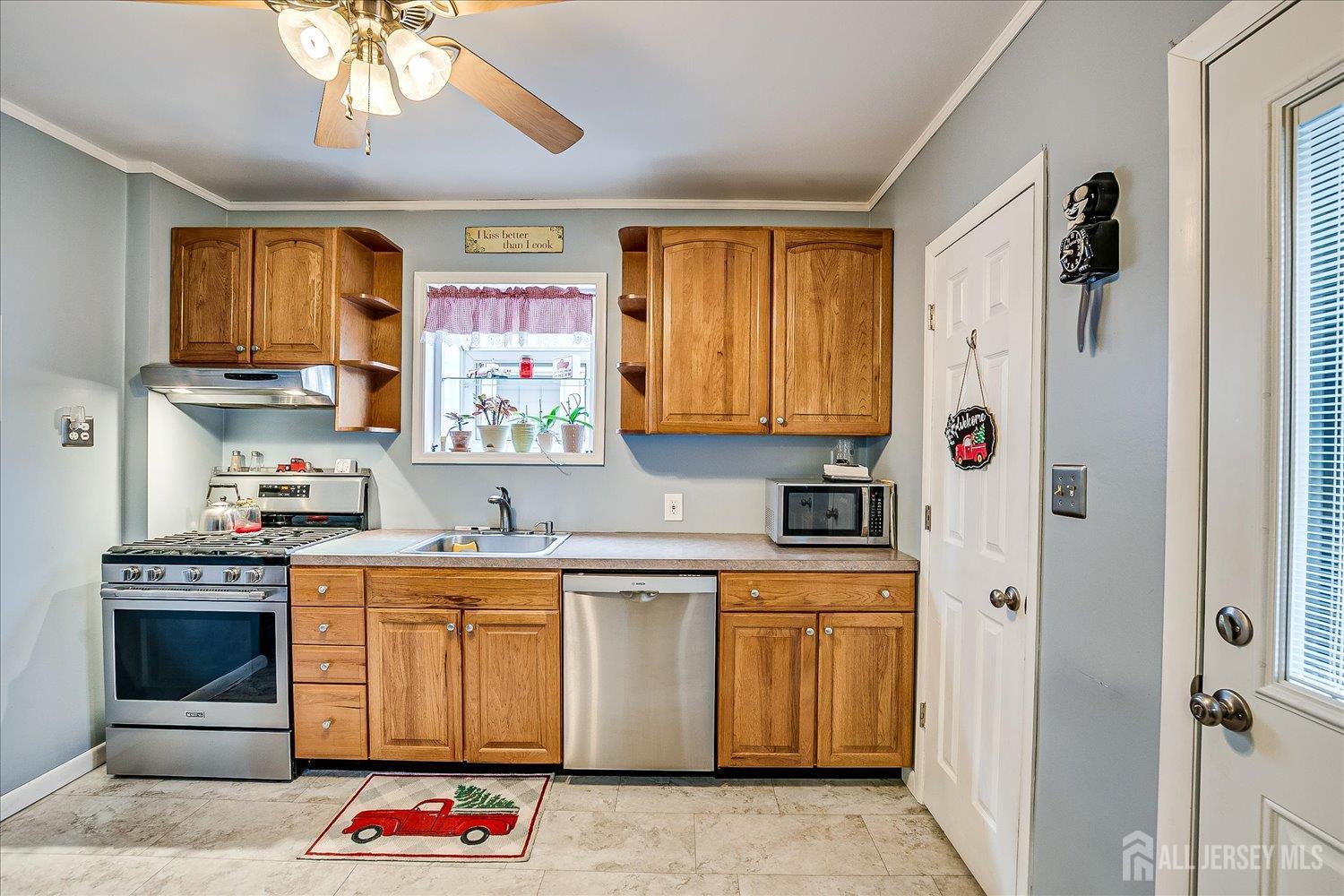 7 Clum Avenue Fords, NJ 08863 - Photo 17 of 43 a kitchen with stainless steel appliances granite countertop a stove a sink and a refrigerator