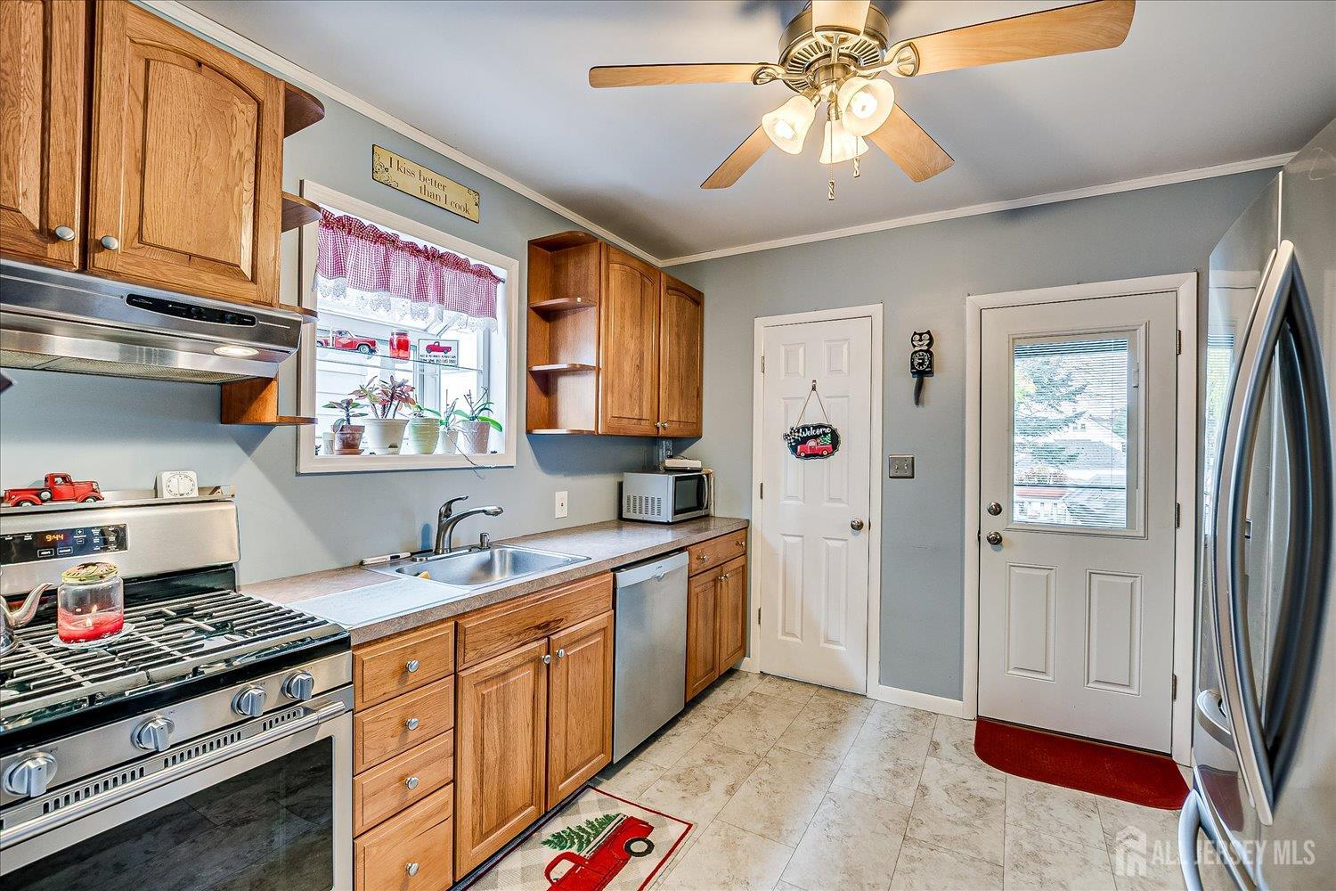 7 Clum Avenue Fords, NJ 08863 - Photo 18 of 43 a kitchen with stainless steel appliances granite countertop a sink and a refrigerator