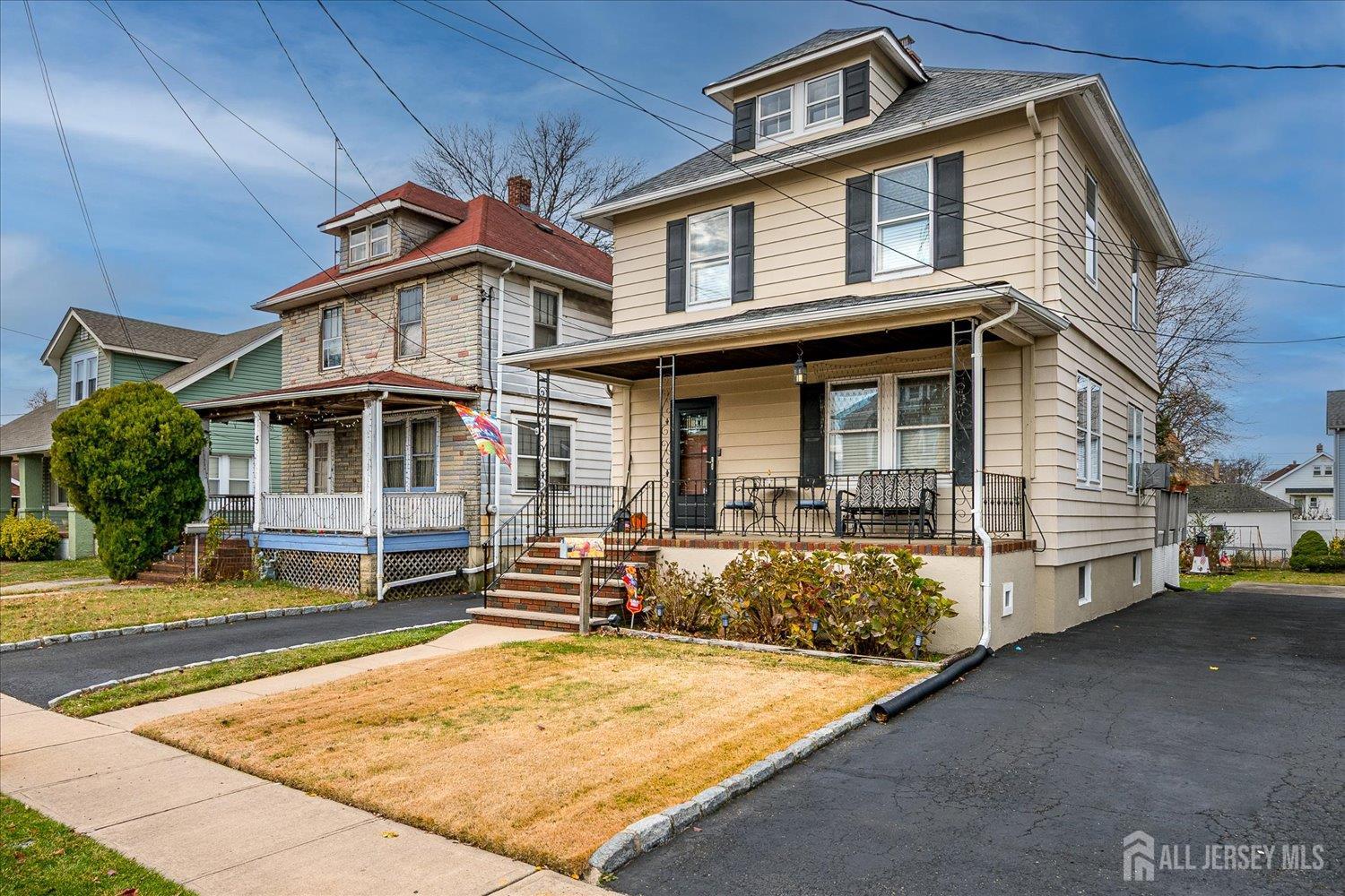 7 Clum Avenue Fords, NJ 08863 - Photo 2 of 43 a front view of a house with a yard