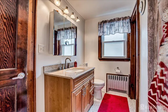 a bathroom with 2 sink and a mirror