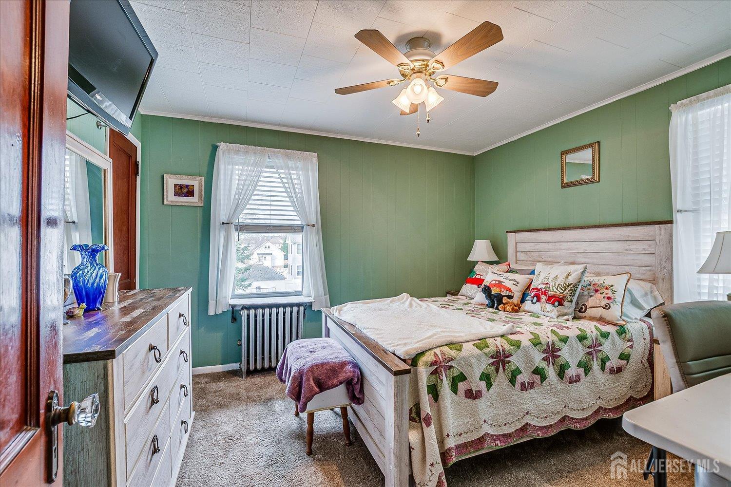 7 Clum Avenue Fords, NJ 08863 - Photo 26 of 43 a bedroom with a bed window and a chandelier