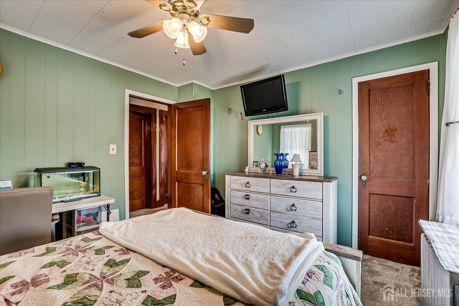 7 Clum Avenue Fords, NJ 08863 - Photo 27 of 43 a bedroom with a bed and a chandelier