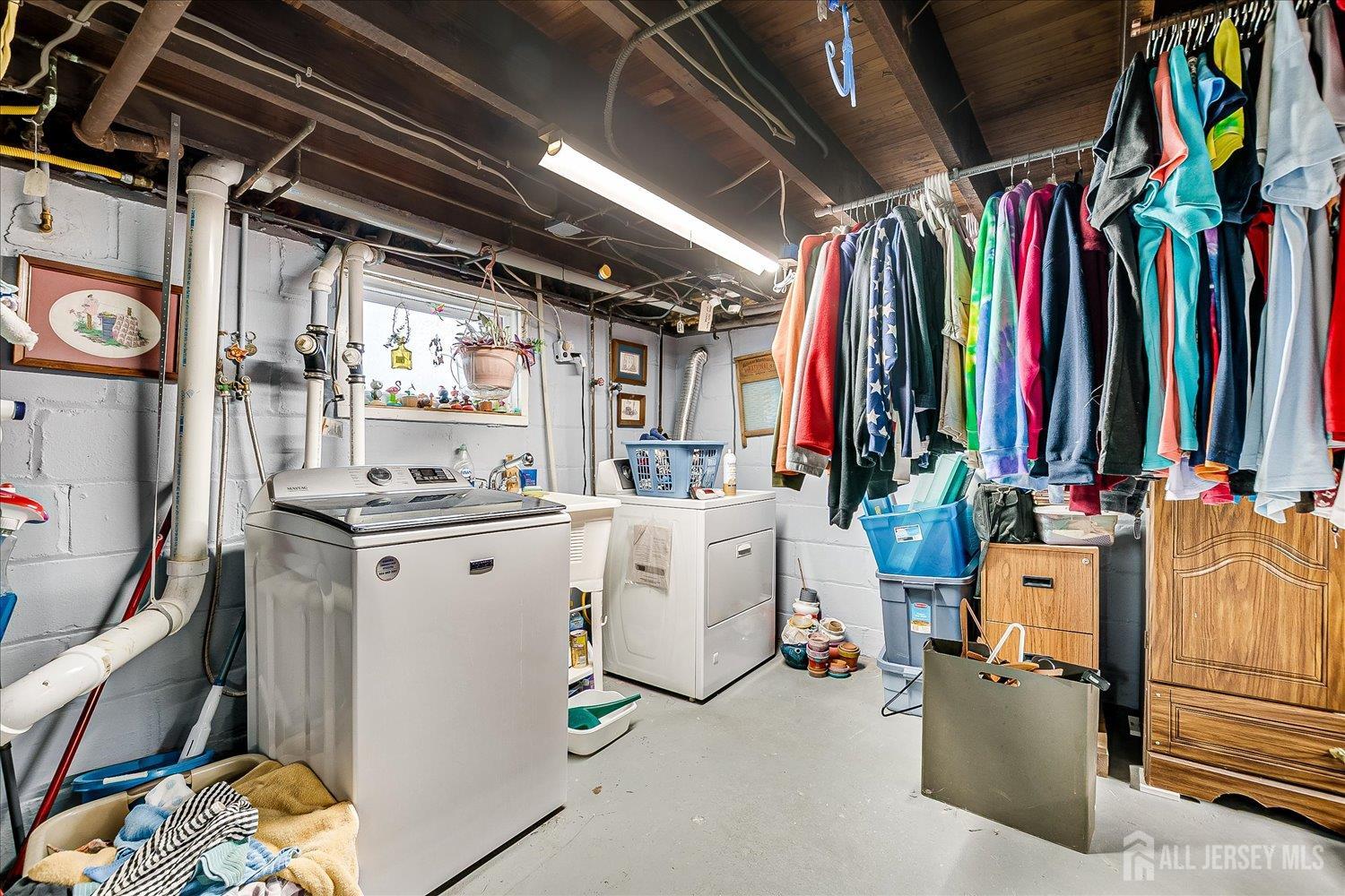 7 Clum Avenue Fords, NJ 08863 - Photo 31 of 43 a view of walk in closet with clothes and shoes