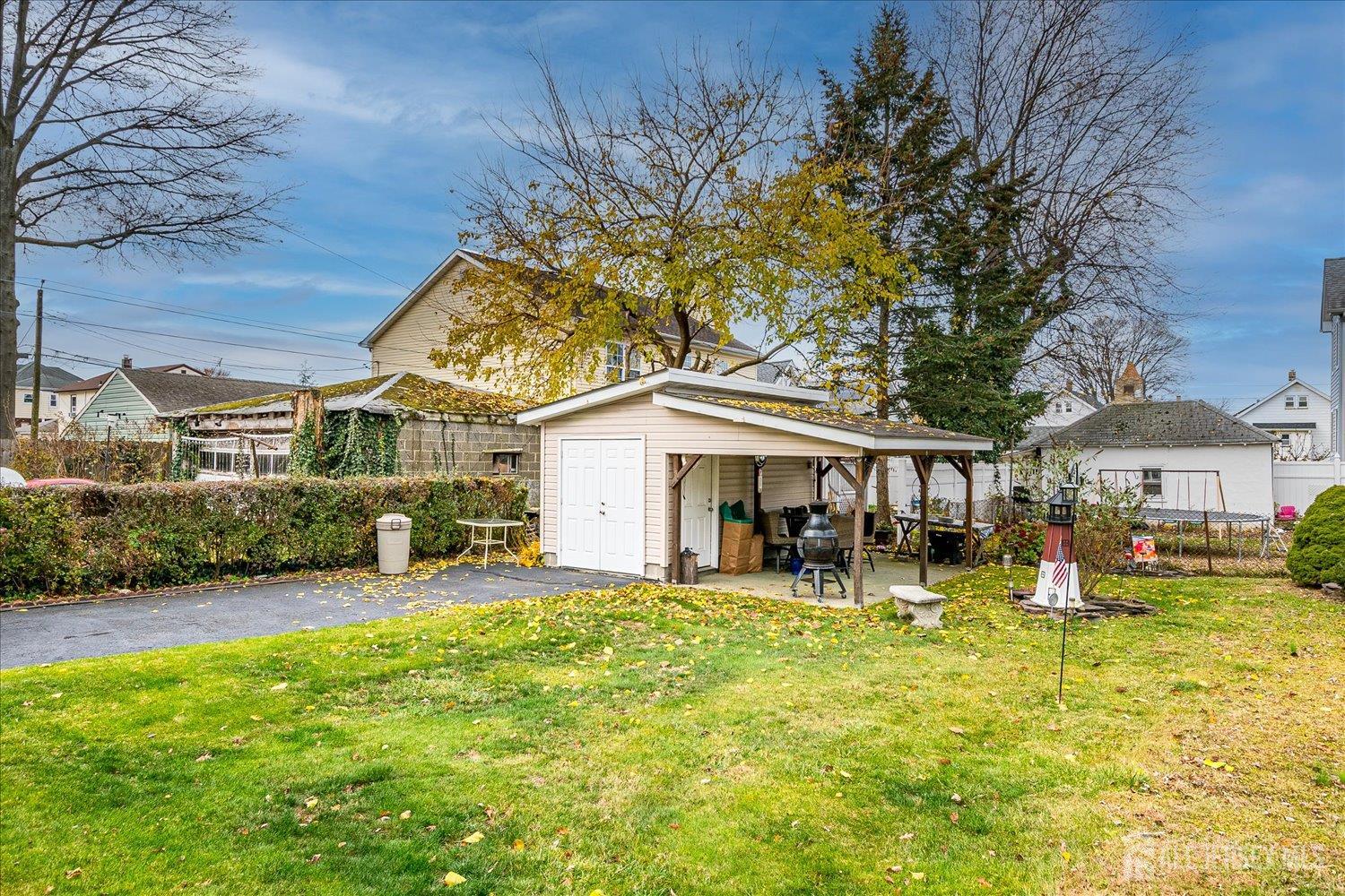 7 Clum Avenue Fords, NJ 08863 - Photo 36 of 43 a view of a house with a yard patio and fire pit