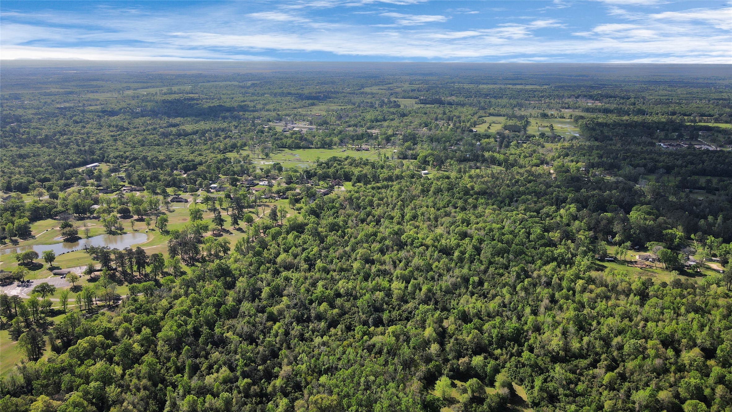 938 Minglewood Road Liberty, TX 77575 - Photo 7 of 16 a view of a field with an ocean