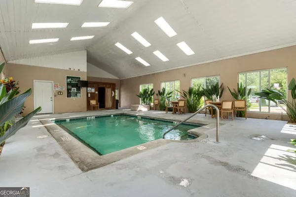a view of swimming pool with outdoor seating