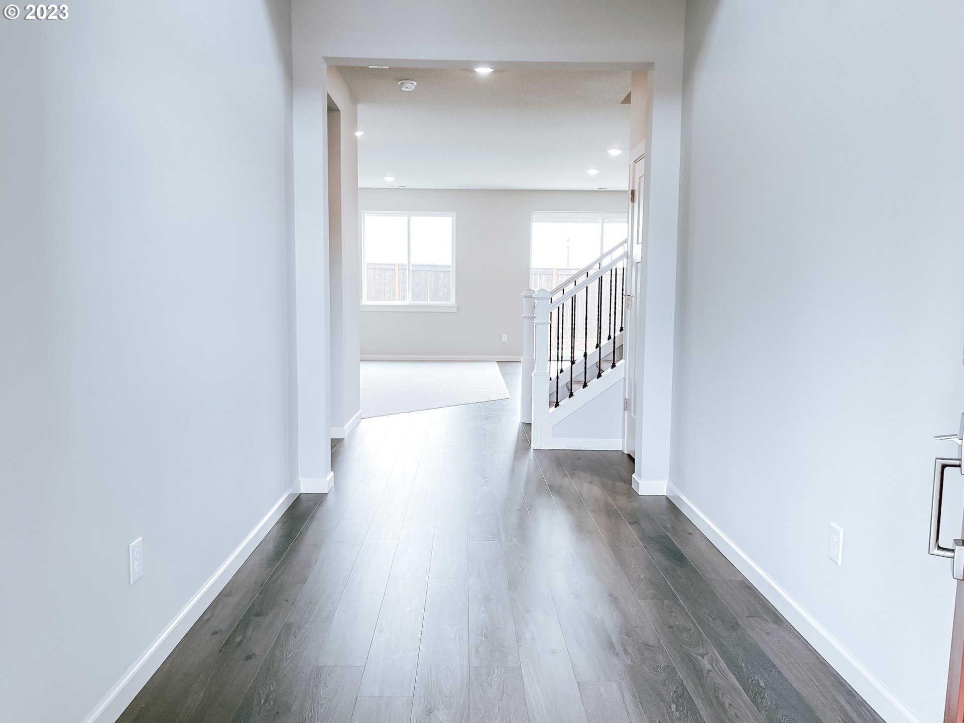 802 South 29th Court Ridgefield, WA 98642 - Photo 2 of 24 a view of a hallway with wooden floor