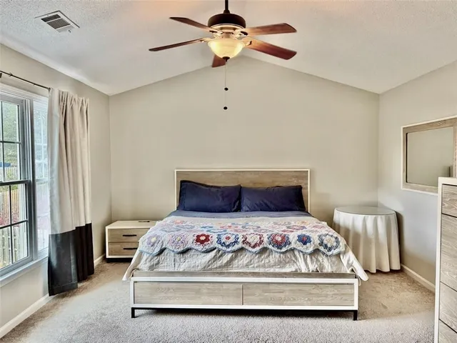 a bathroom with a sink a large mirror and a bathtub