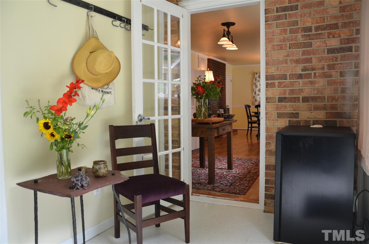 4604 Blanchard Road Durham, NC 27713 - Photo 12 of 25 a dining room with furniture and a potted plant