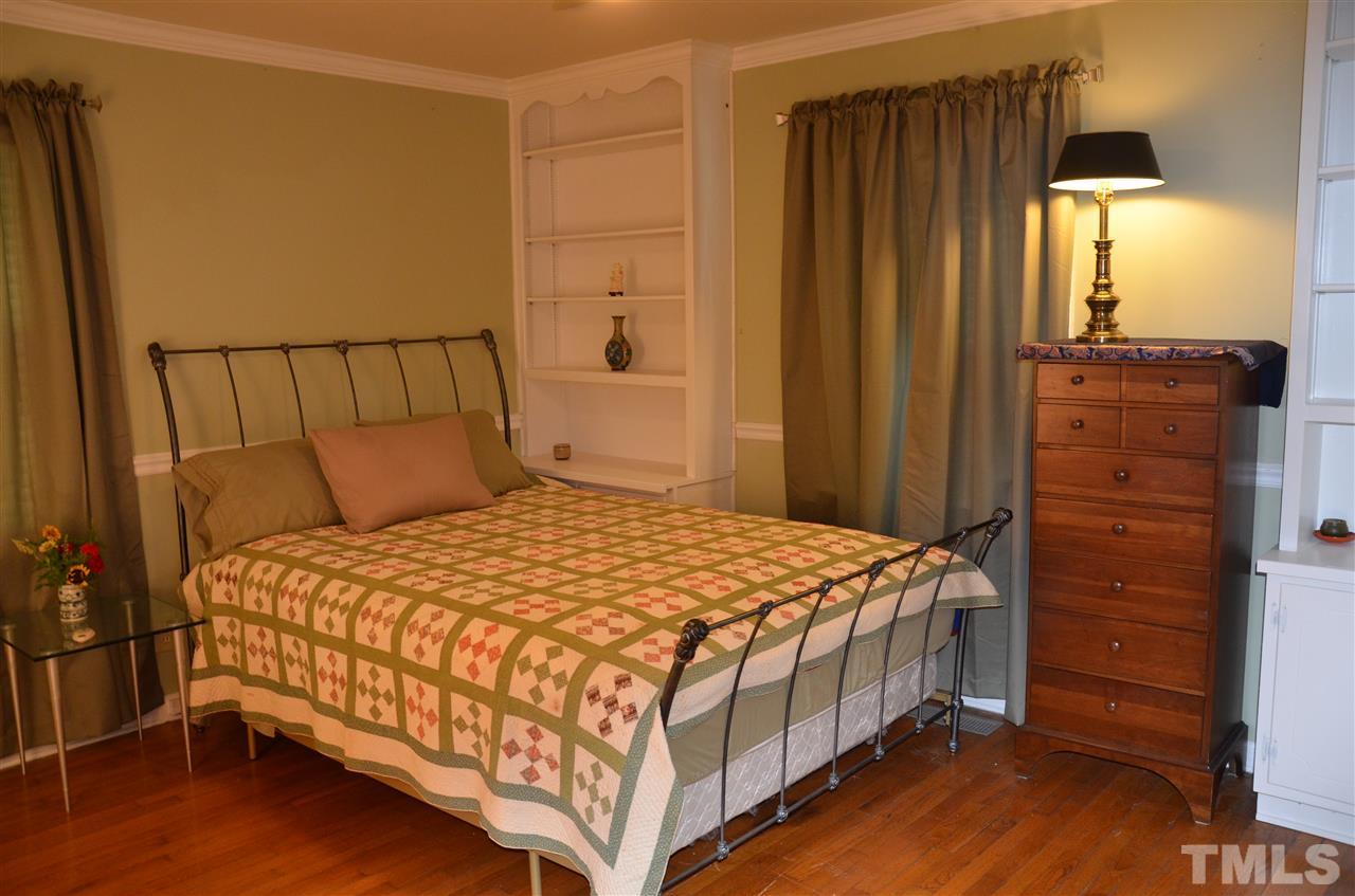 4604 Blanchard Road Durham, NC 27713 - Photo 13 of 25 a bedroom with a bed and a dresser