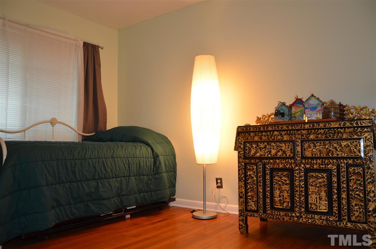 4604 Blanchard Road Durham, NC 27713 - Photo 16 of 25 a bedroom with a bed and a window