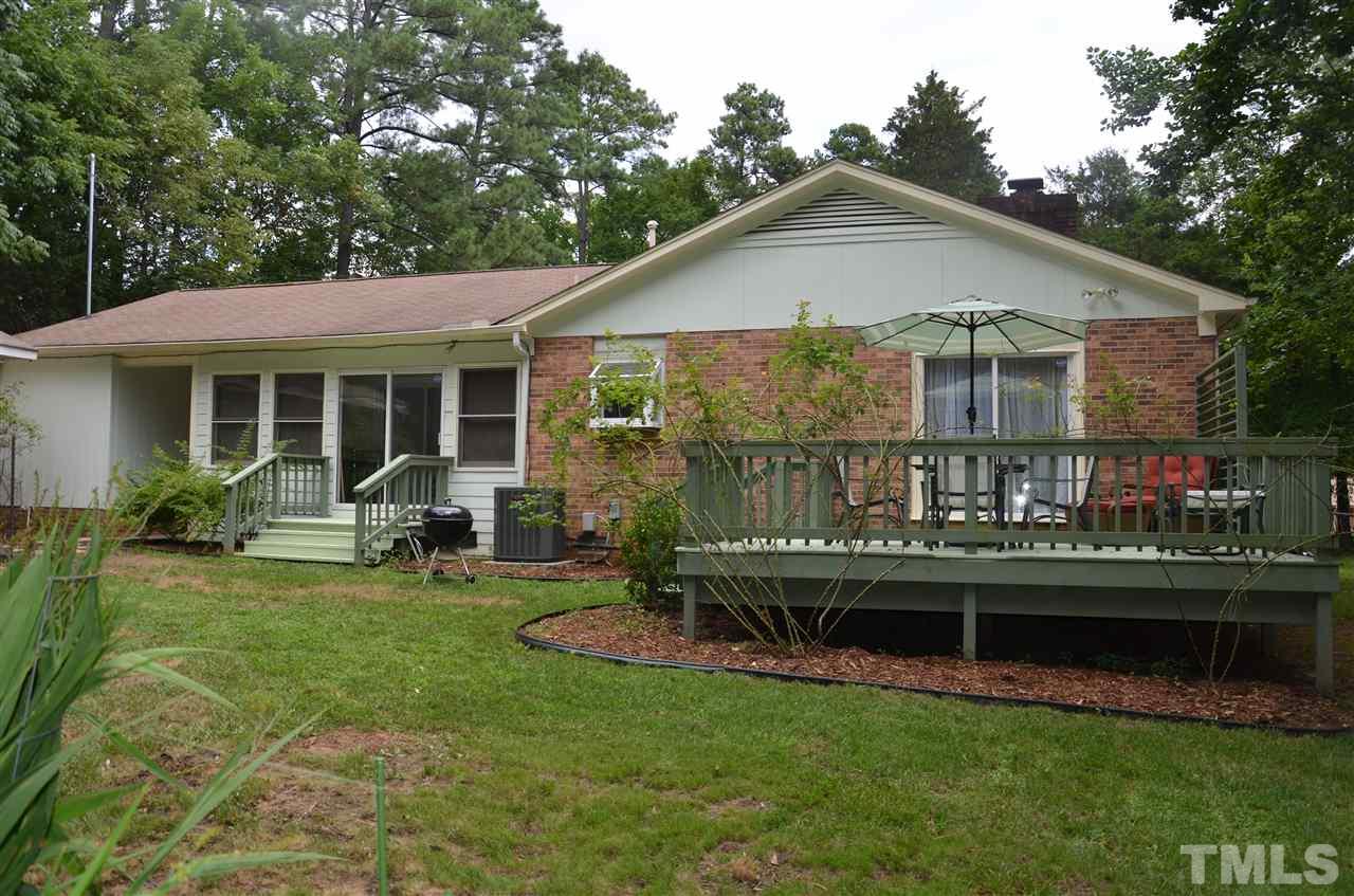 4604 Blanchard Road Durham, NC 27713 - Photo 19 of 25 a front view of a house with a yard table and chairs