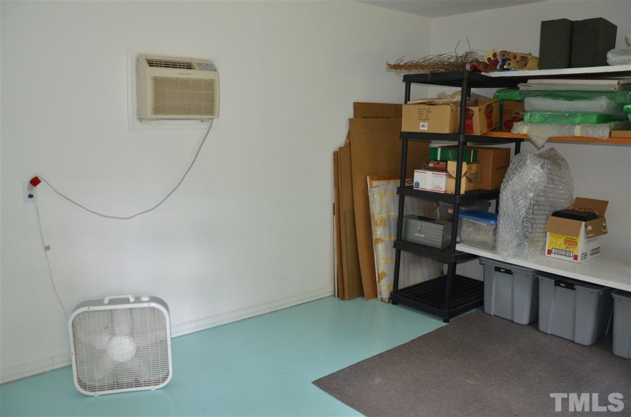 4604 Blanchard Road Durham, NC 27713 - Photo 23 of 25 a room with furniture and a potted plant