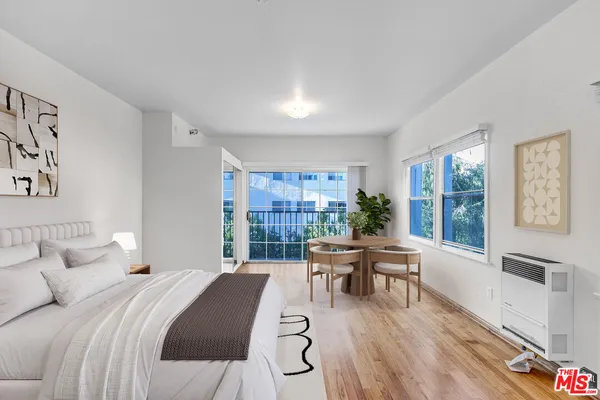 a bed room with a bed and a desk