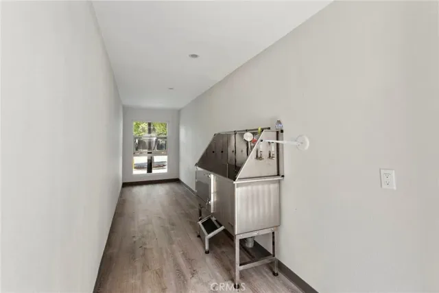 a view of a livingroom with furniture and wooden floor