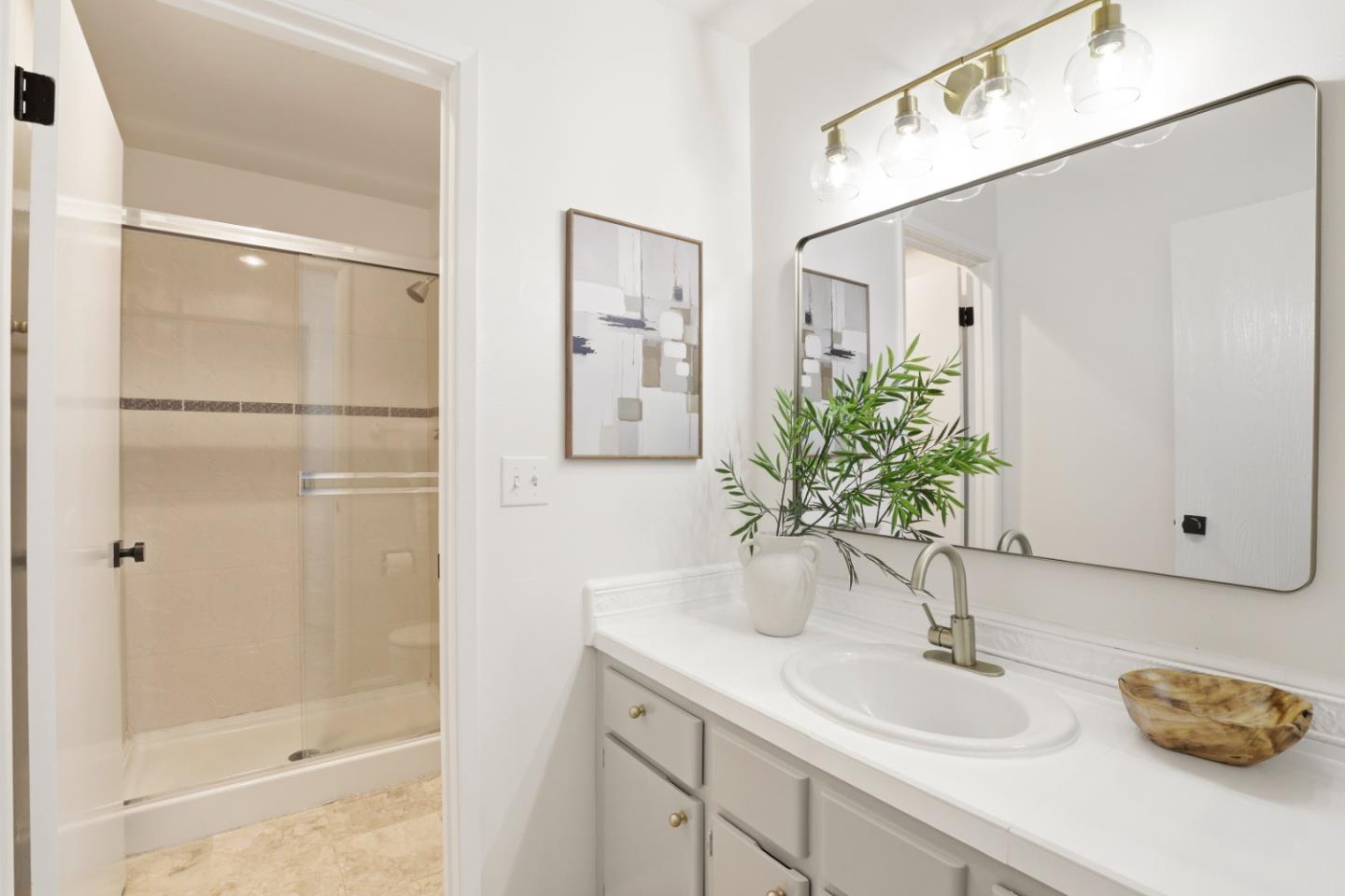 100 East Middlefield Road, Unit 3B Mountain View, CA 94043 - Photo 17 of 32 a bathroom with a granite countertop shower sink and toilet