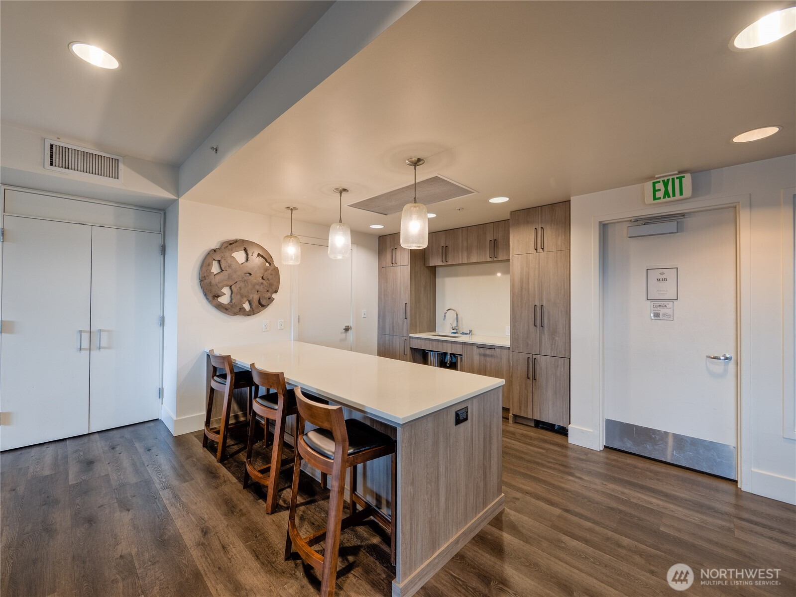 910 Lenora Street, Unit 200 Seattle, WA 98121 - Photo 15 of 23 a large kitchen with a table and chairs